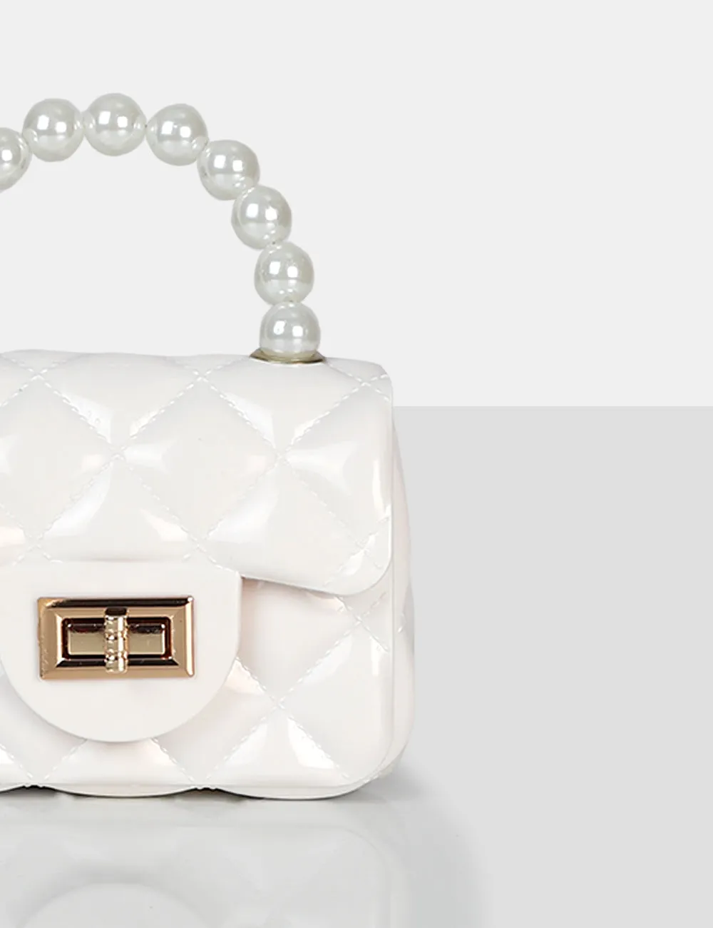 The Iddy White Patent Pearl Mini Bag